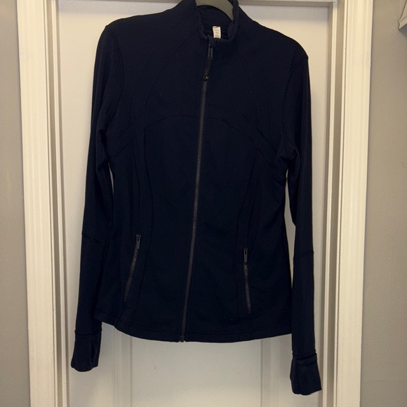 Lululemon Athletica navy
Luon Define
Size 12
Zipup jacket
Thumb holes 
Pockets - Picture 1 of 7